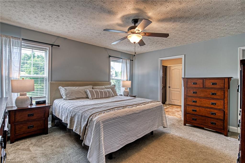 108 Seaton Crest Drive Mars, PA 16046 - Photo 13 of 25 a bedroom with a bed and a chandelier