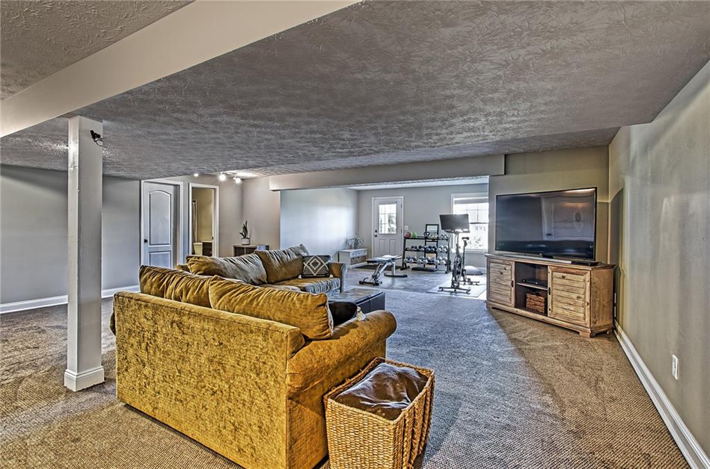 108 Seaton Crest Drive Mars, PA 16046 - Photo 19 of 25 a living room with furniture and a flat screen tv
