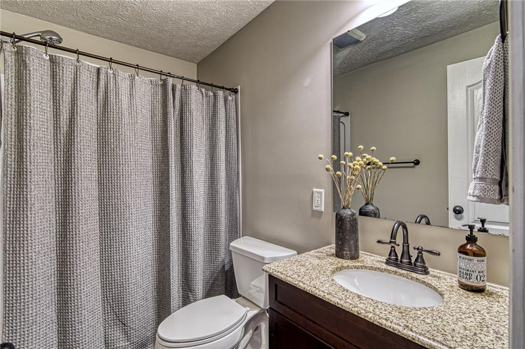 108 Seaton Crest Drive Mars, PA 16046 - Photo 20 of 25 a bathroom with a granite countertop sink toilet and mirror