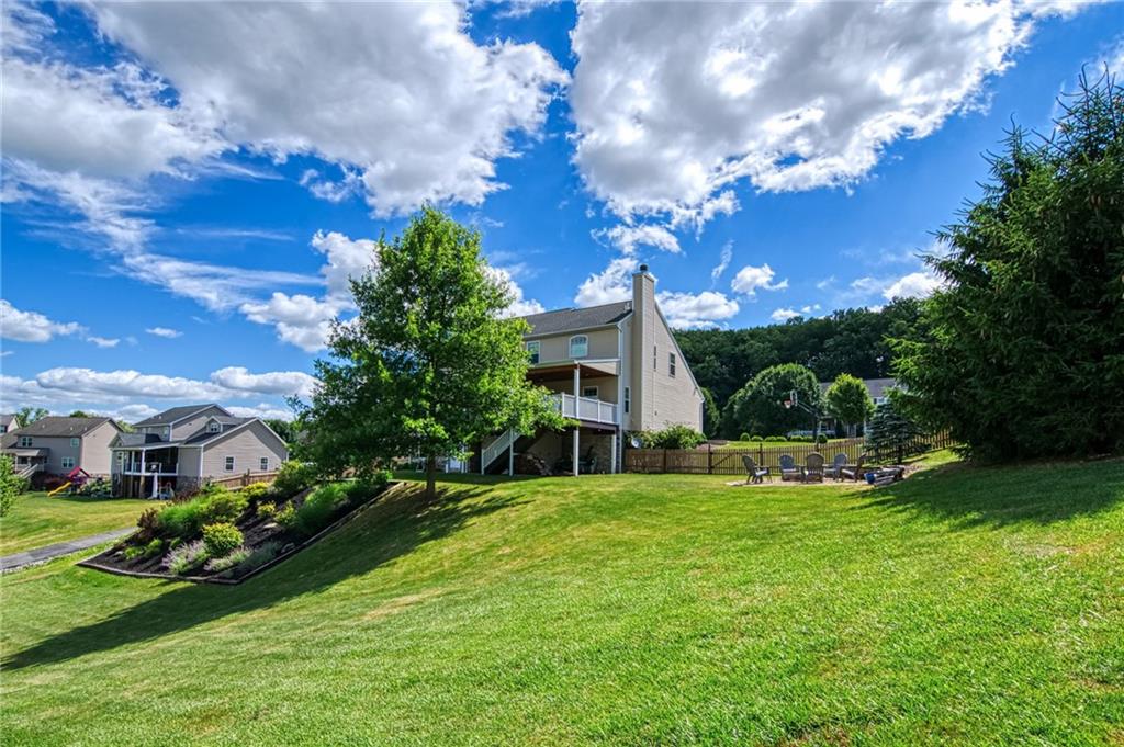 108 Seaton Crest Drive Mars, PA 16046 - Photo 21 of 25 a view of a house with a big yard and large trees