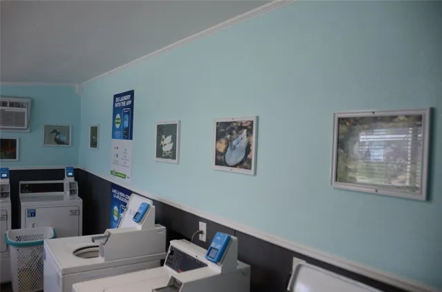 a utility room with cabinets