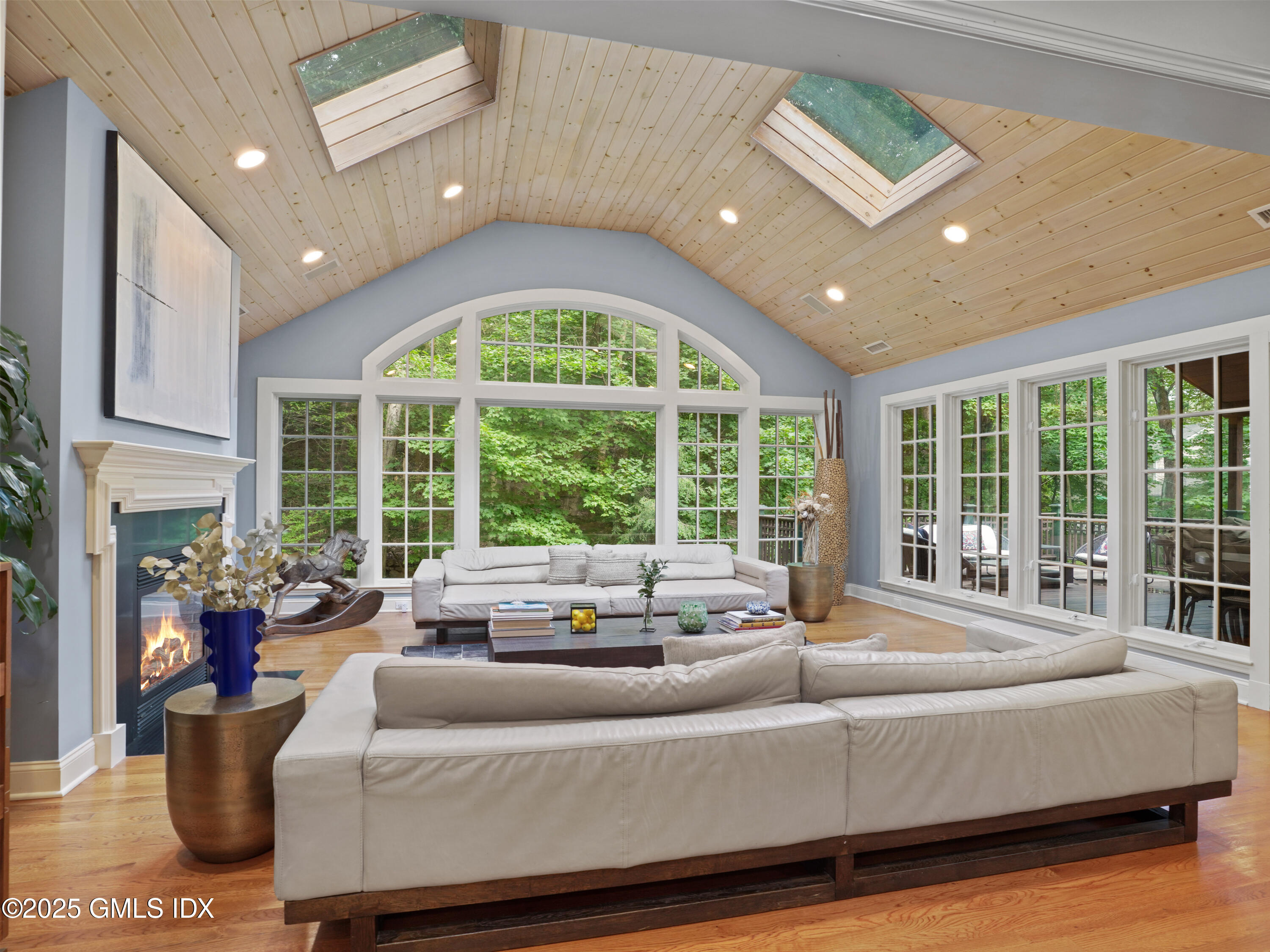 25 Jeffrey Road Greenwich, CT 06830 - Photo 11 of 35 a living room with furniture and a large window