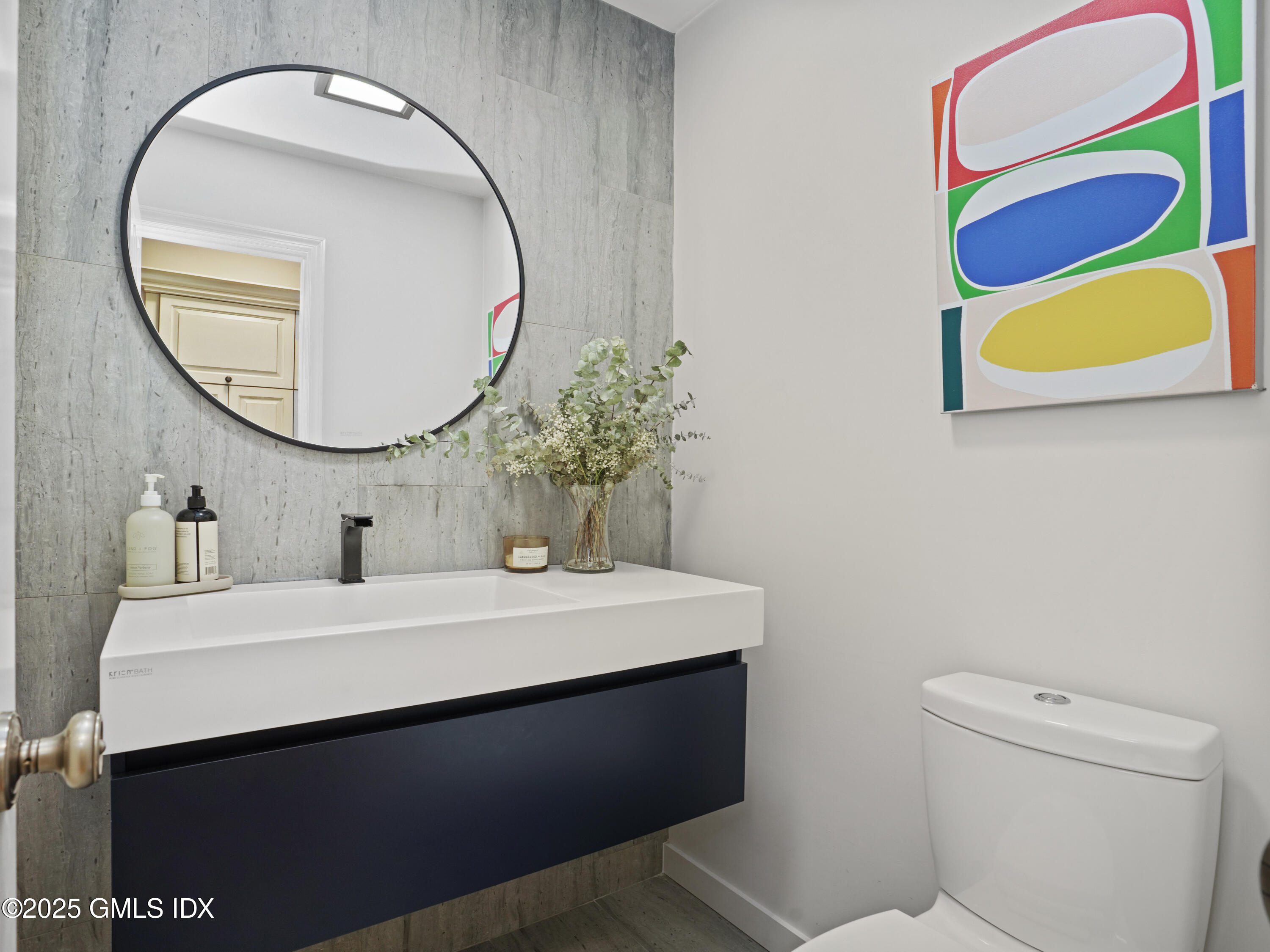 25 Jeffrey Road Greenwich, CT 06830 - Photo 14 of 35 a bathroom with a sink a mirror and a toilet