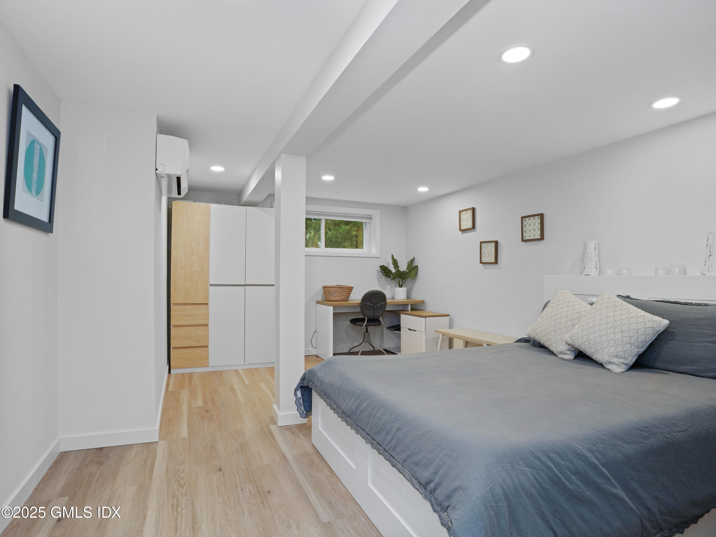 25 Jeffrey Road Greenwich, CT 06830 - Photo 26 of 35 a bed room with a bed and a refrigerator