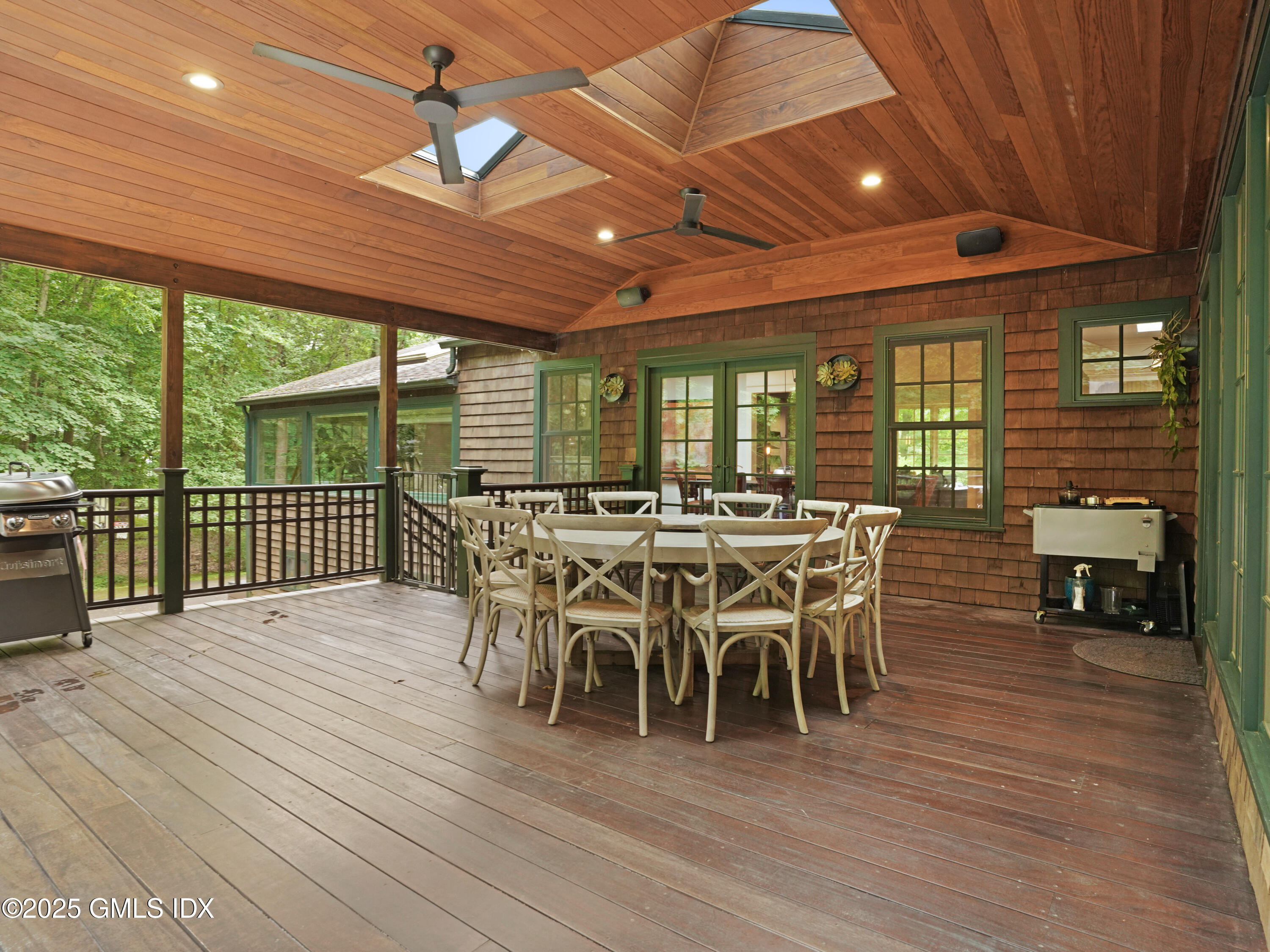 25 Jeffrey Road Greenwich, CT 06830 - Photo 29 of 35 a view of a dining room with furniture window and wooden floor