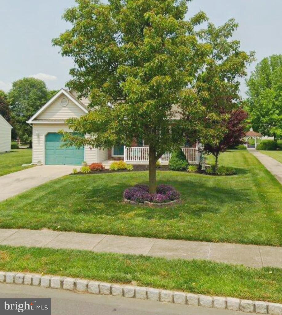 415 Country Way Mickleton, NJ 08056 - Photo 3 of 26 a front view of a house with a yard