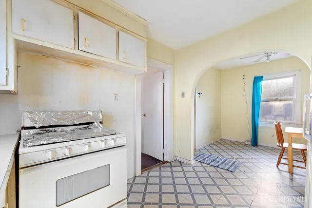 a kitchen with a stove and a refrigerator