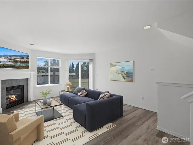 a living room with furniture window and a fireplace