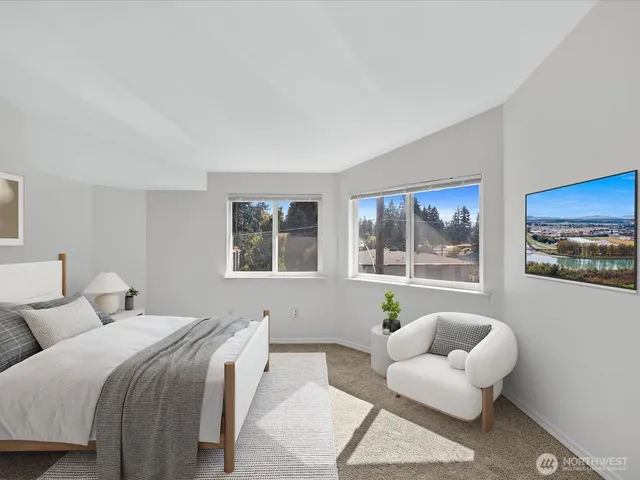 a bedroom with a bed and a couch