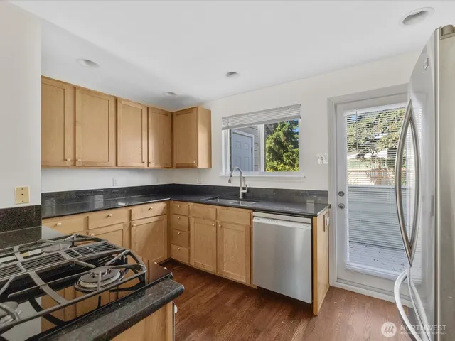 a kitchen with a stove and a sink