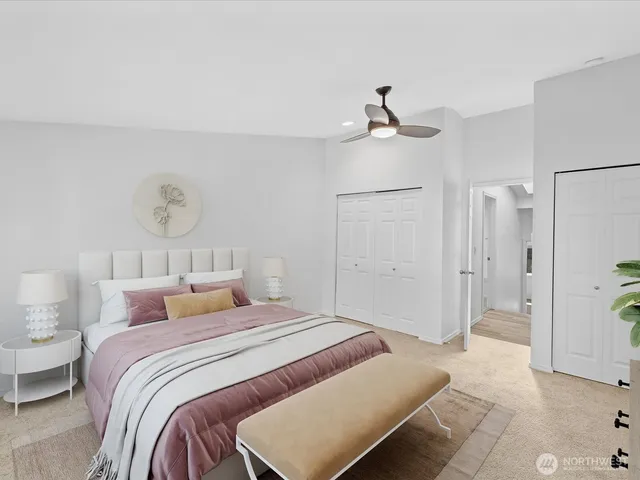 a bedroom with a bed and a table