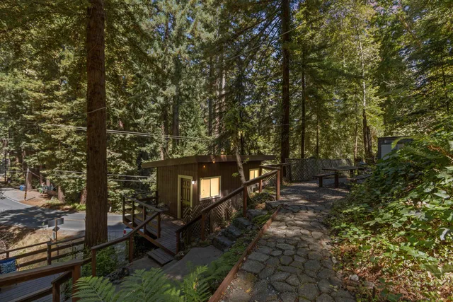 a front view of a house with outdoor seating