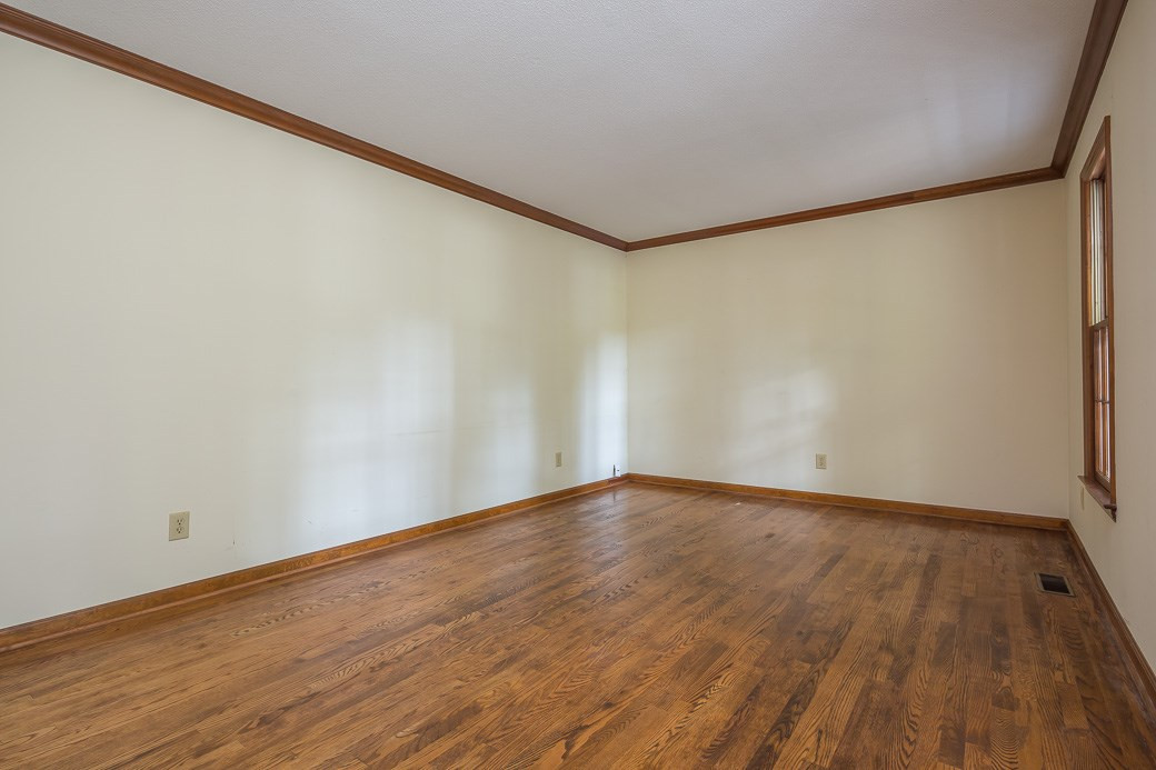 6700 Colony Court Raleigh, NC 27613 - Photo 7 of 21 Formal living room features nicely maintained hardwoods and wood crown molding! Living Room