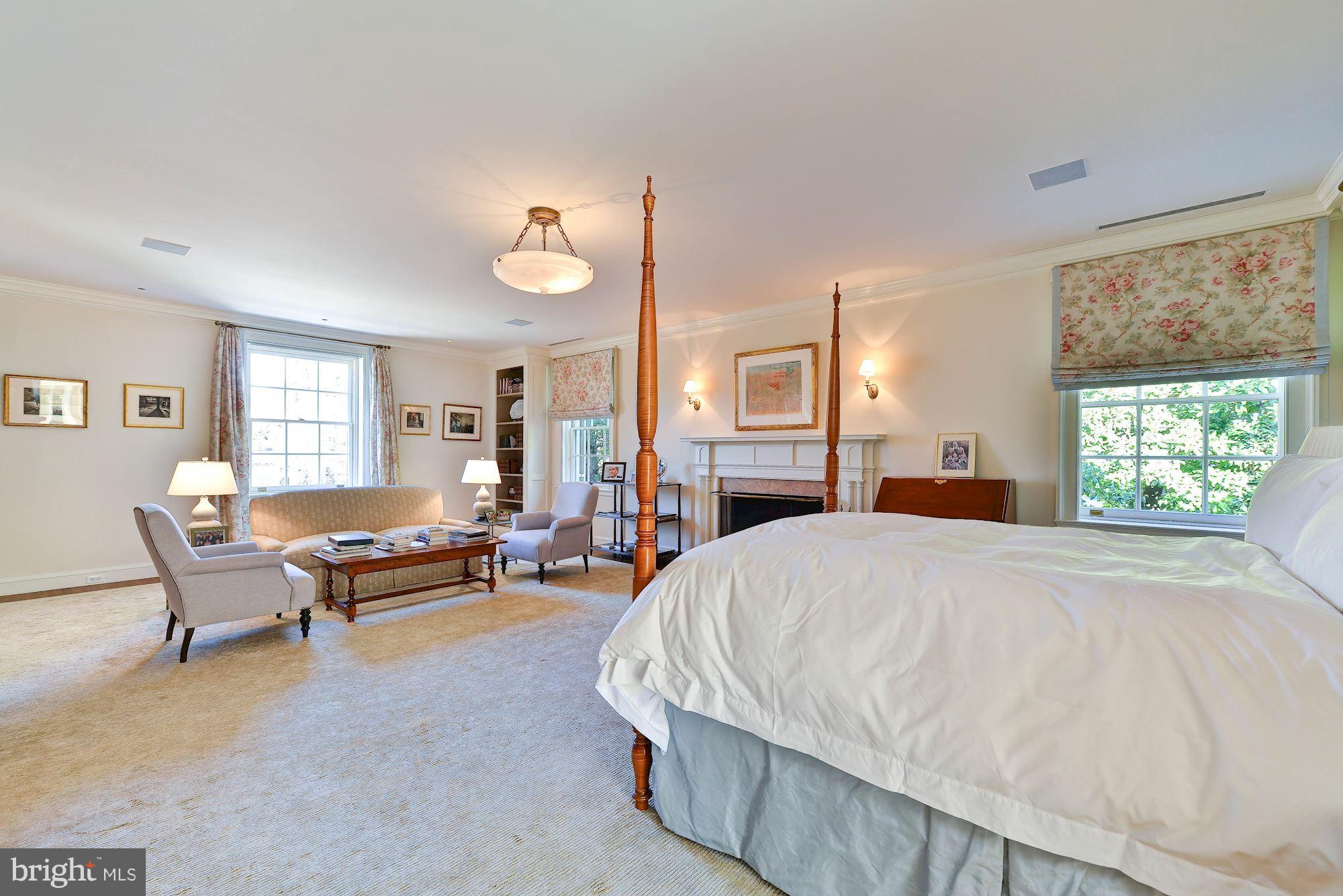 1901 24th Street Northwest Washington, DC 20008 - Photo 13 of 27 a bedroom with a bed wooden floor and windows