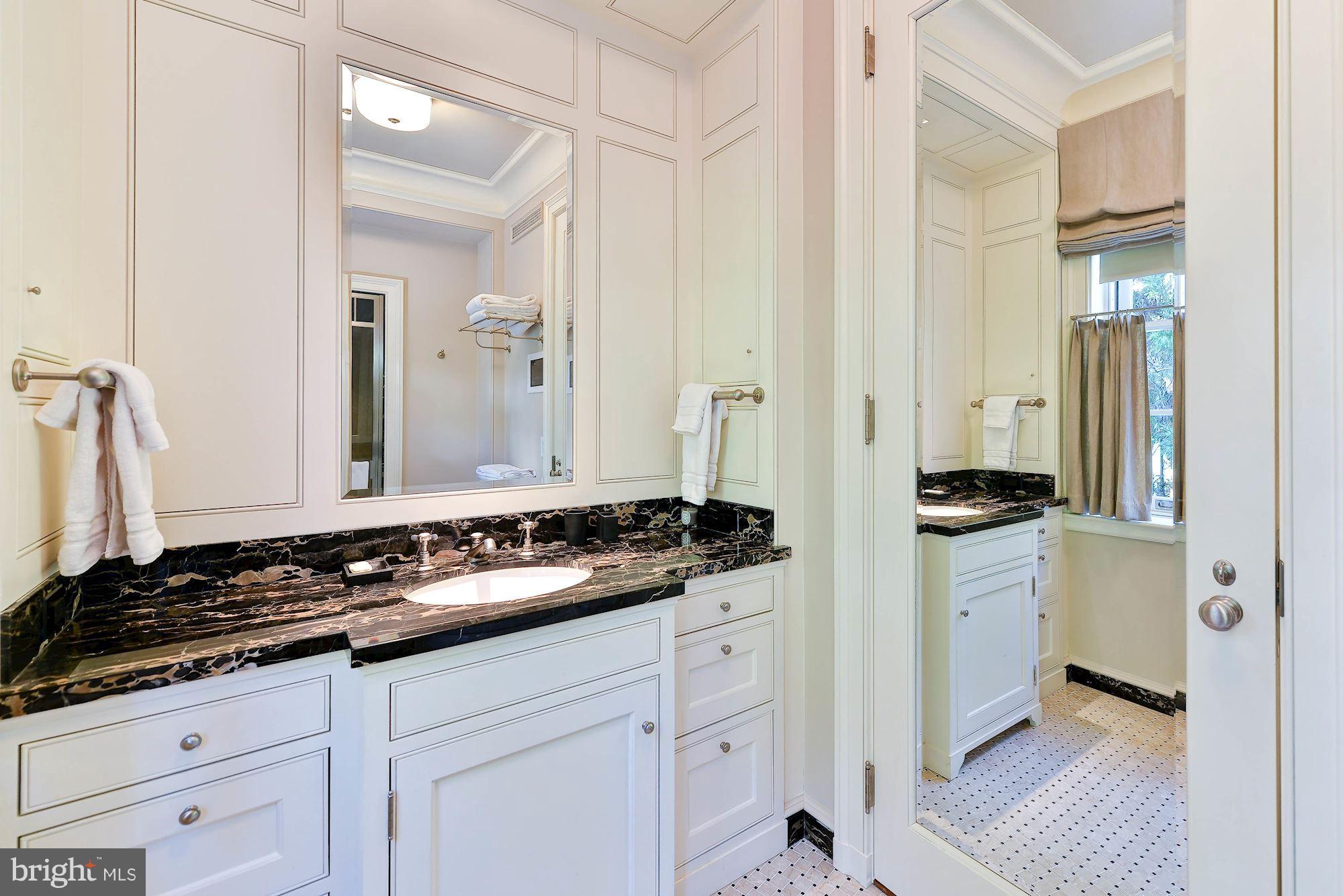 1901 24th Street Northwest Washington, DC 20008 - Photo 16 of 27 a bathroom with a granite countertop sink and a mirror