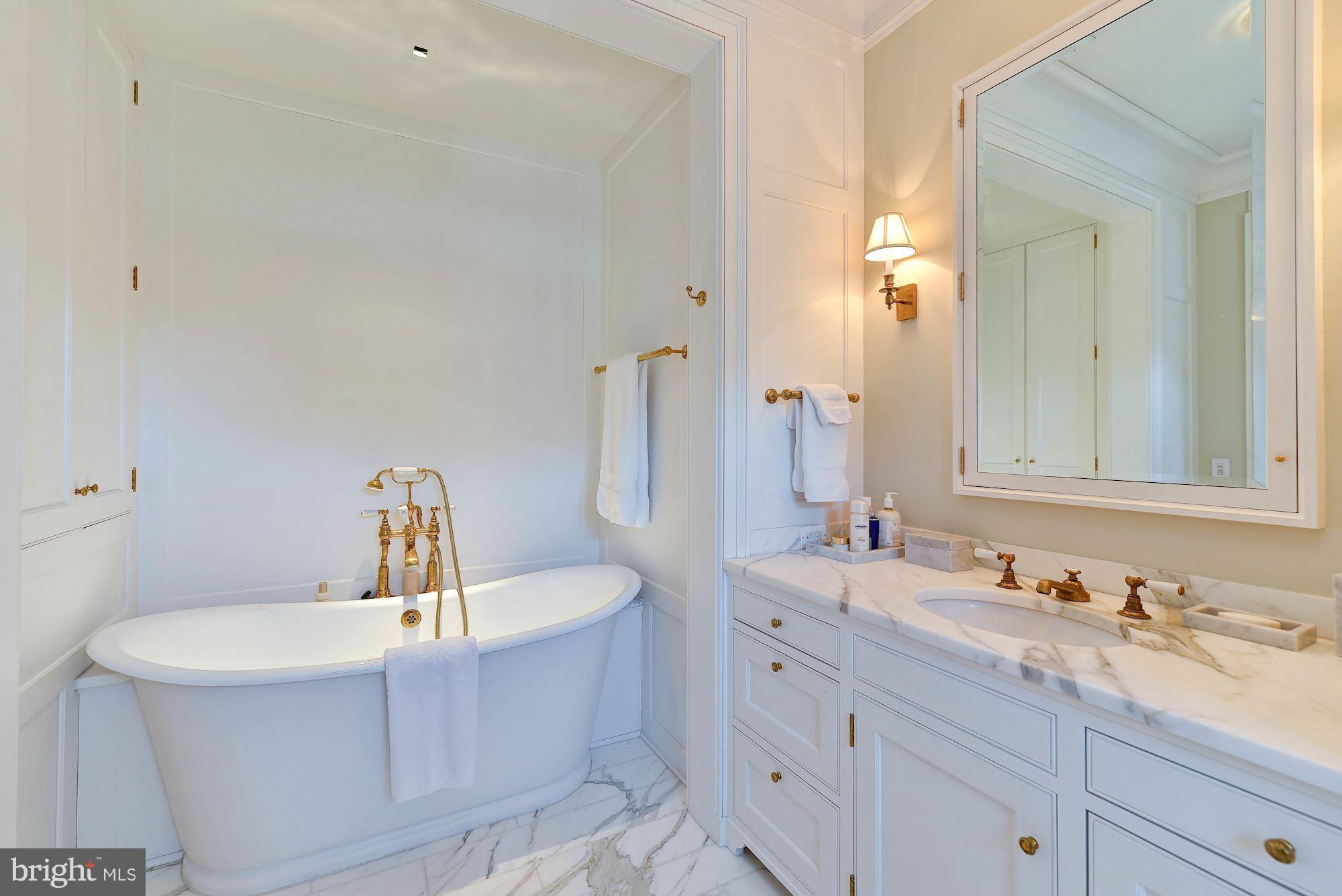 1901 24th Street Northwest Washington, DC 20008 - Photo 19 of 27 a bathroom with a sink and a mirror