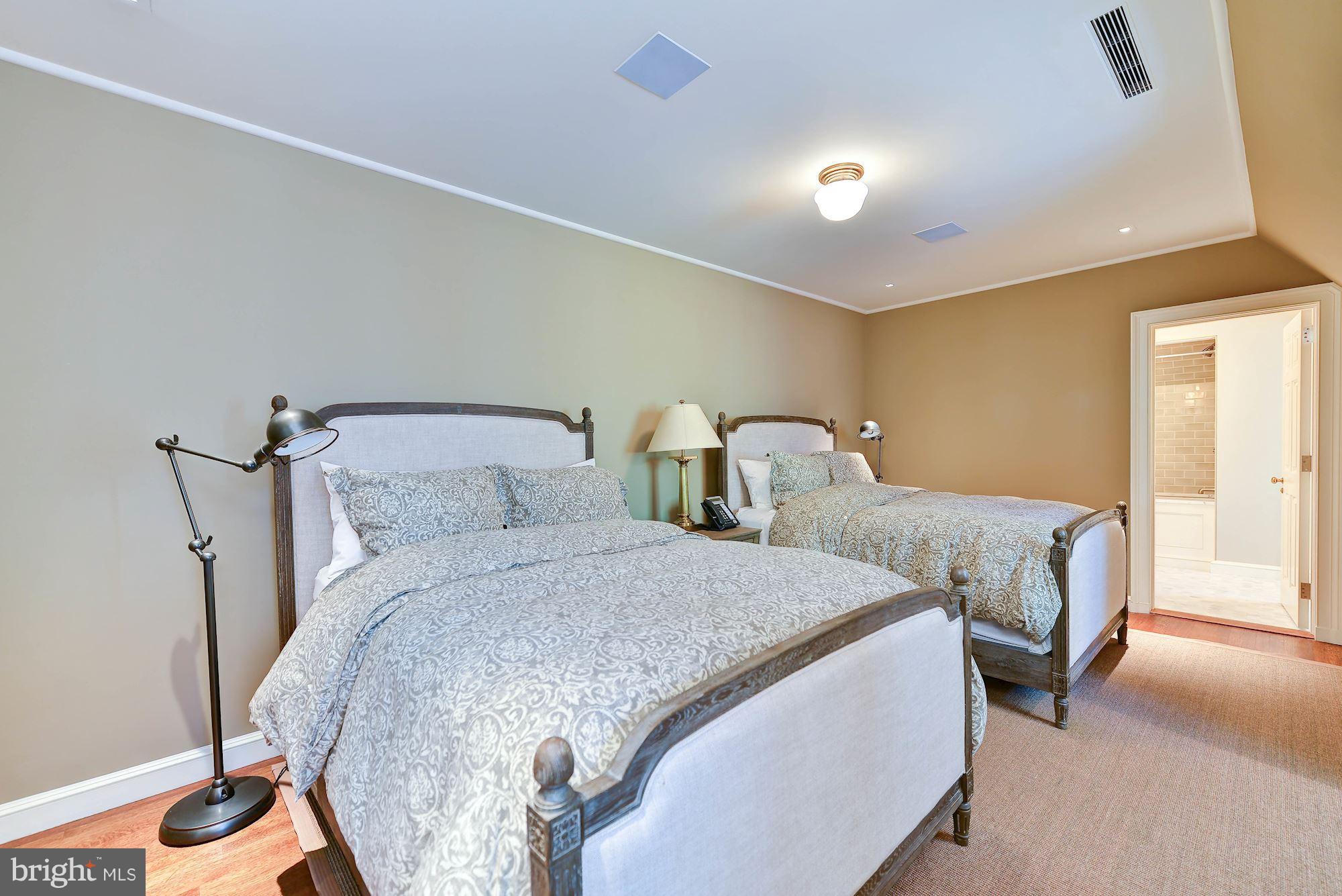 1901 24th Street Northwest Washington, DC 20008 - Photo 25 of 27 a bedroom with two beds and painted walls