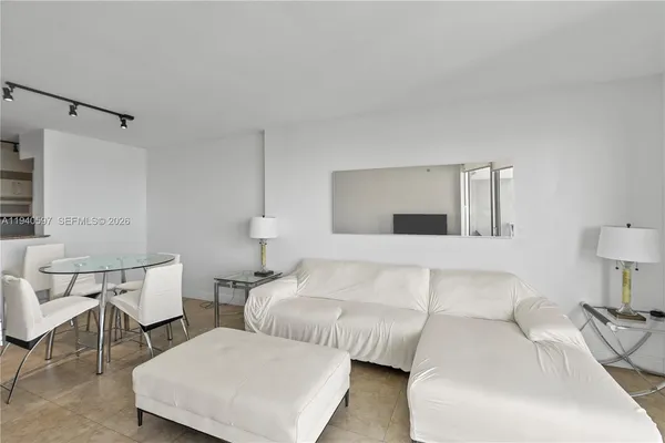 a bedroom with a bed and chair