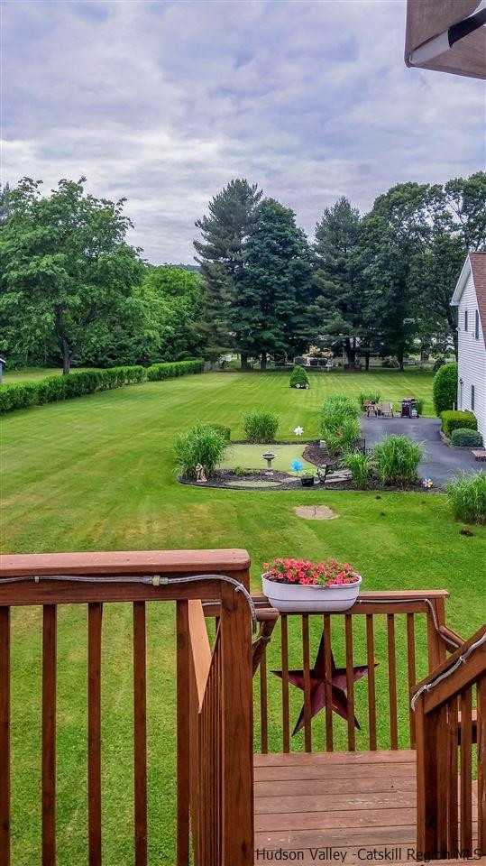 735 Springtown Road Tillson, NY 12486 - Photo 15 of 35 an outdoor view of a garden with an outdoor seating