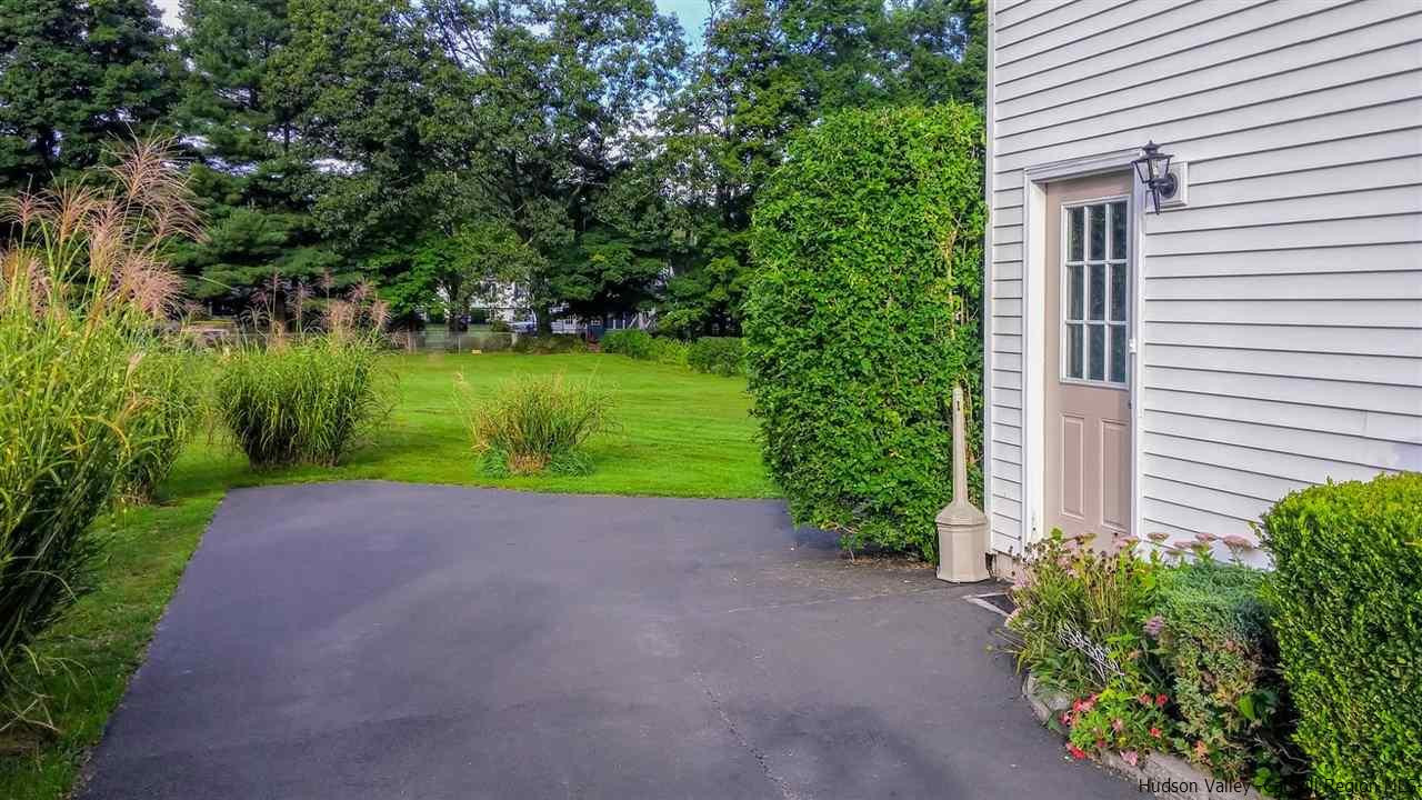735 Springtown Road Tillson, NY 12486 - Photo 16 of 35 a view of a house with a yard and potted plants