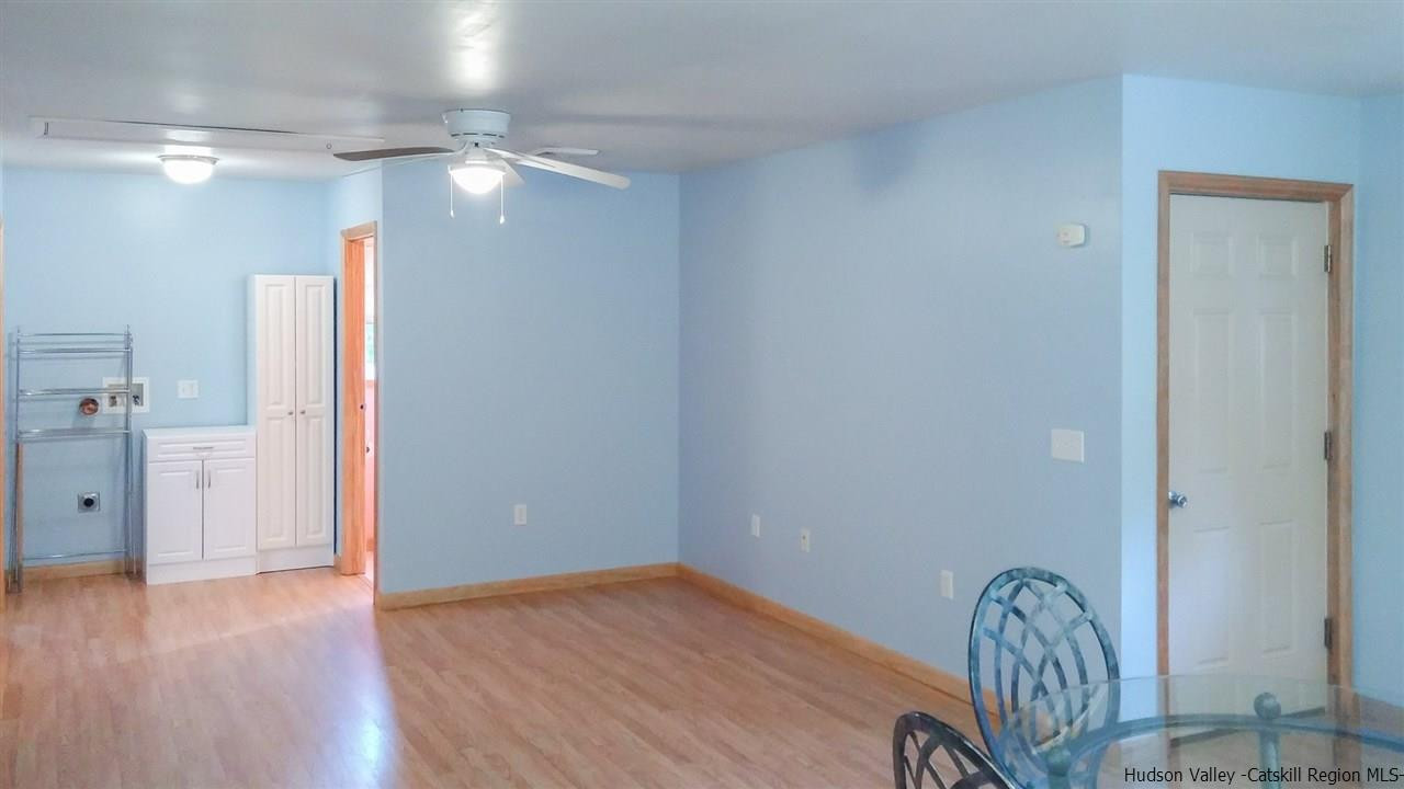 735 Springtown Road Tillson, NY 12486 - Photo 19 of 35 a view of a hallway with wooden floor and staircase