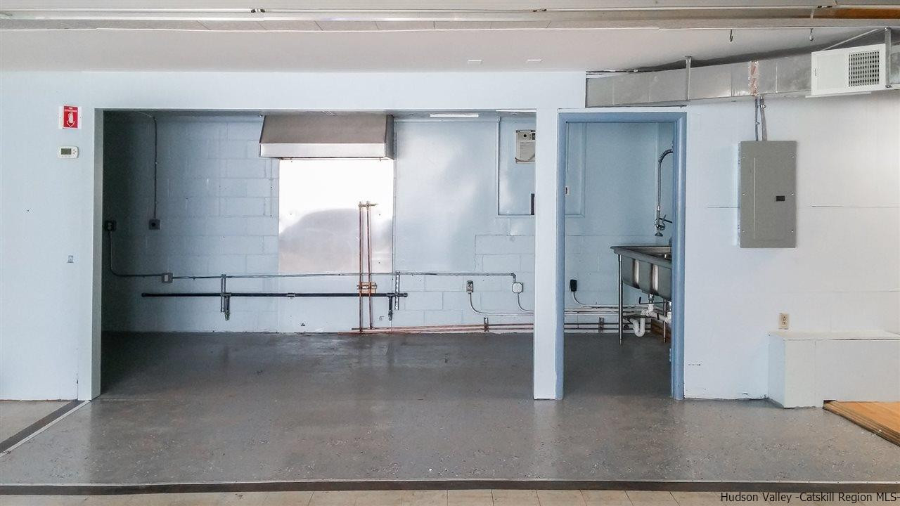 735 Springtown Road Tillson, NY 12486 - Photo 26 of 35 a view of a room with wooden floor and cabinet