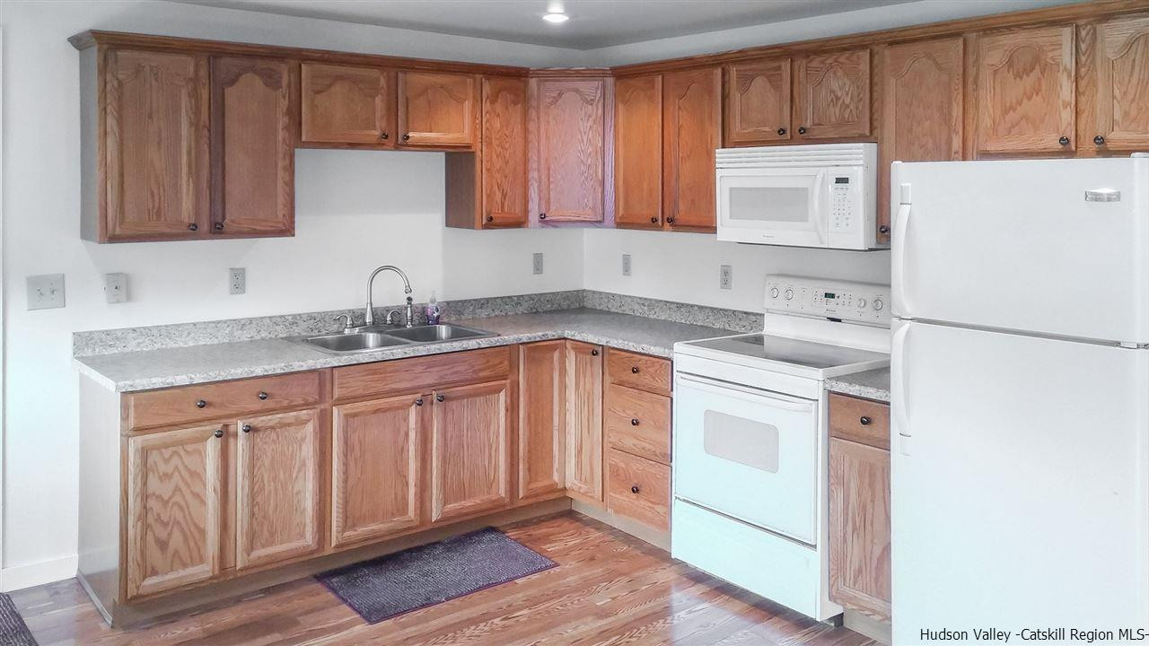 735 Springtown Road Tillson, NY 12486 - Photo 8 of 35 a kitchen with stainless steel appliances granite countertop a sink stove and cabinets