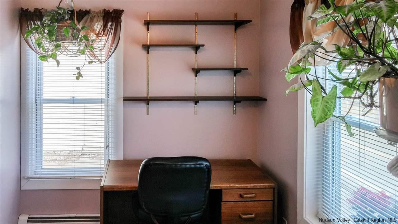 735 Springtown Road Tillson, NY 12486 - Photo 10 of 35 a room with window and flowerpot