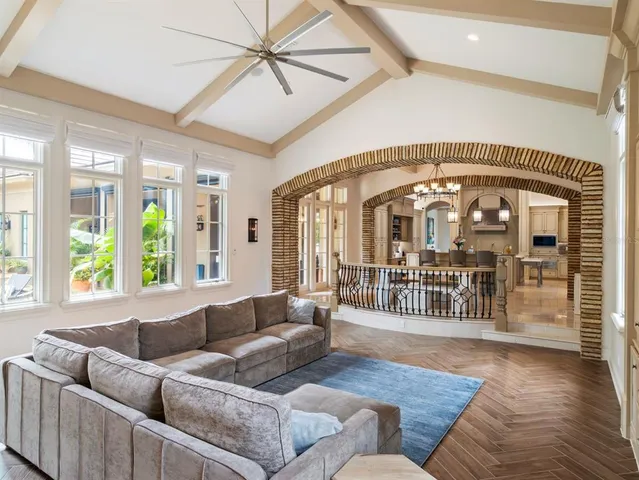 a living room with furniture fireplace and a window