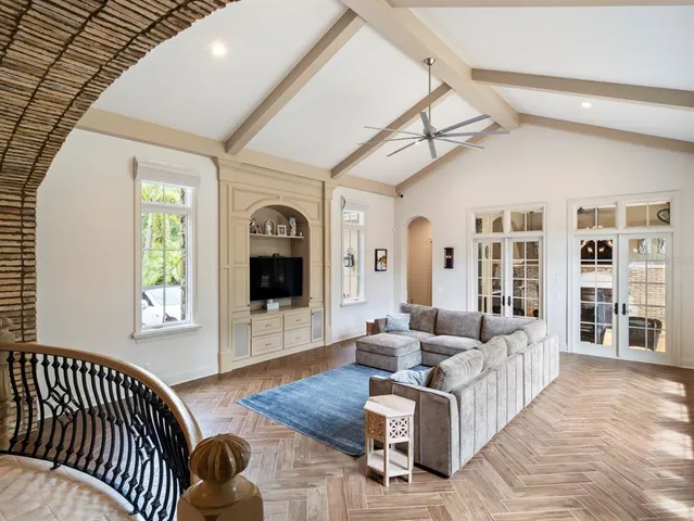 a view of a workspace with furniture and wooden floor