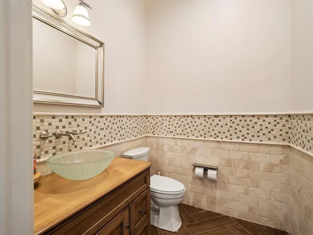 a kitchen with a stove cabinets and stainless steel appliances