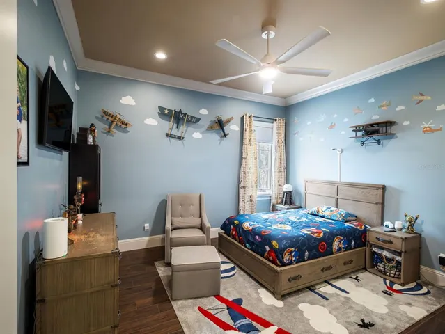 a bathroom with a granite countertop sink a toilet and a mirror