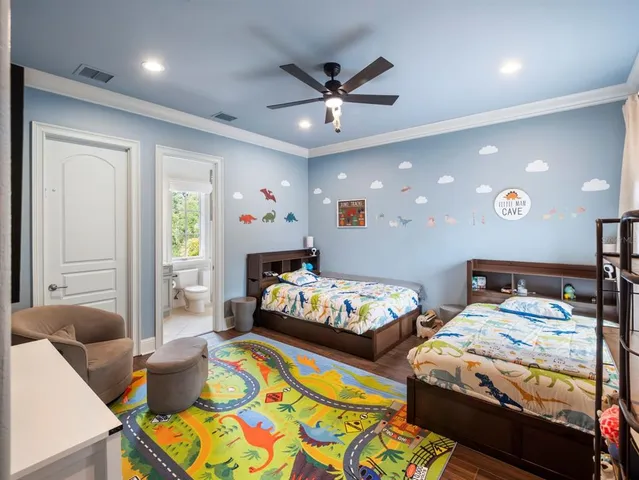 a bathroom with a granite countertop sink a toilet and shower