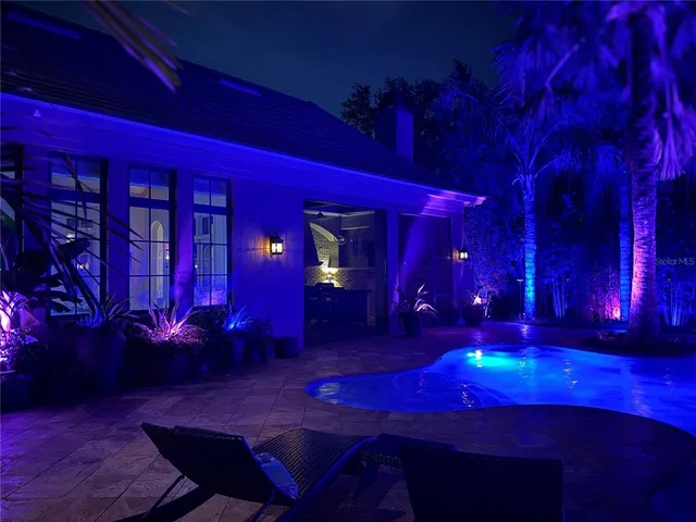 an aerial view of a house with yard and outdoor seating