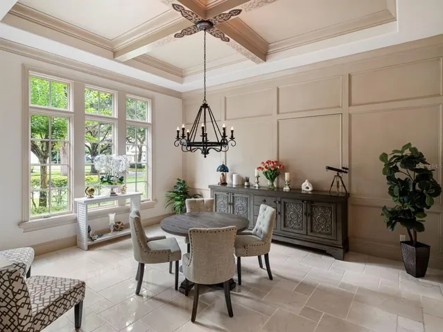 a view of a dining room with furniture window and outside view