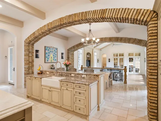 a view of a livingroom with furniture wooden floor and windows