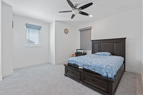 a bedroom with a bed and a dresser