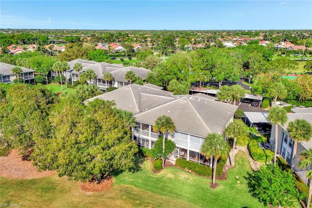8228 Twelve Oaks Circle, Unit 323 Naples, FL 34113 - Photo 22 of 26 Back Aerial View