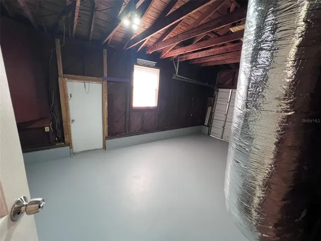 a view of a room with a garage