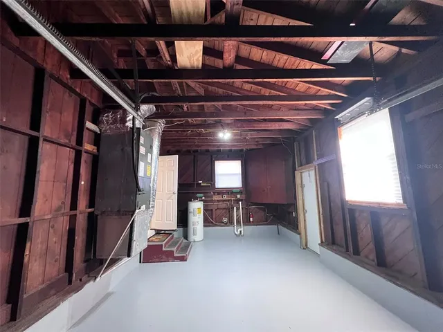 a view of water heater room with window