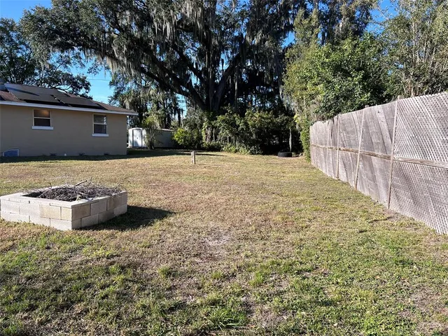 a view of a backyard of a house
