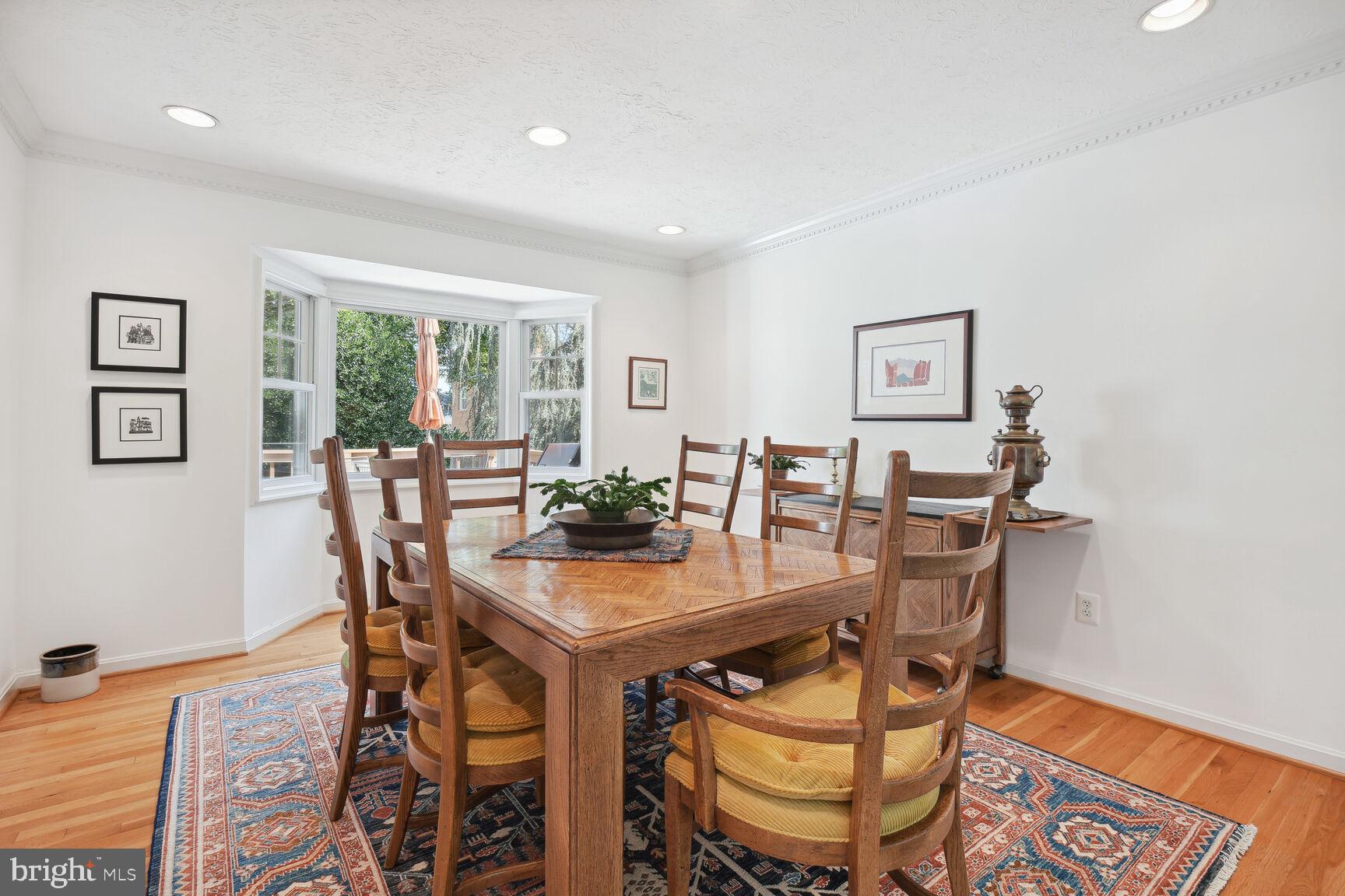 1507 Blue Meadow Road Potomac, MD 20854 - Photo 11 of 36 a view of a dining room with furniture and a large window