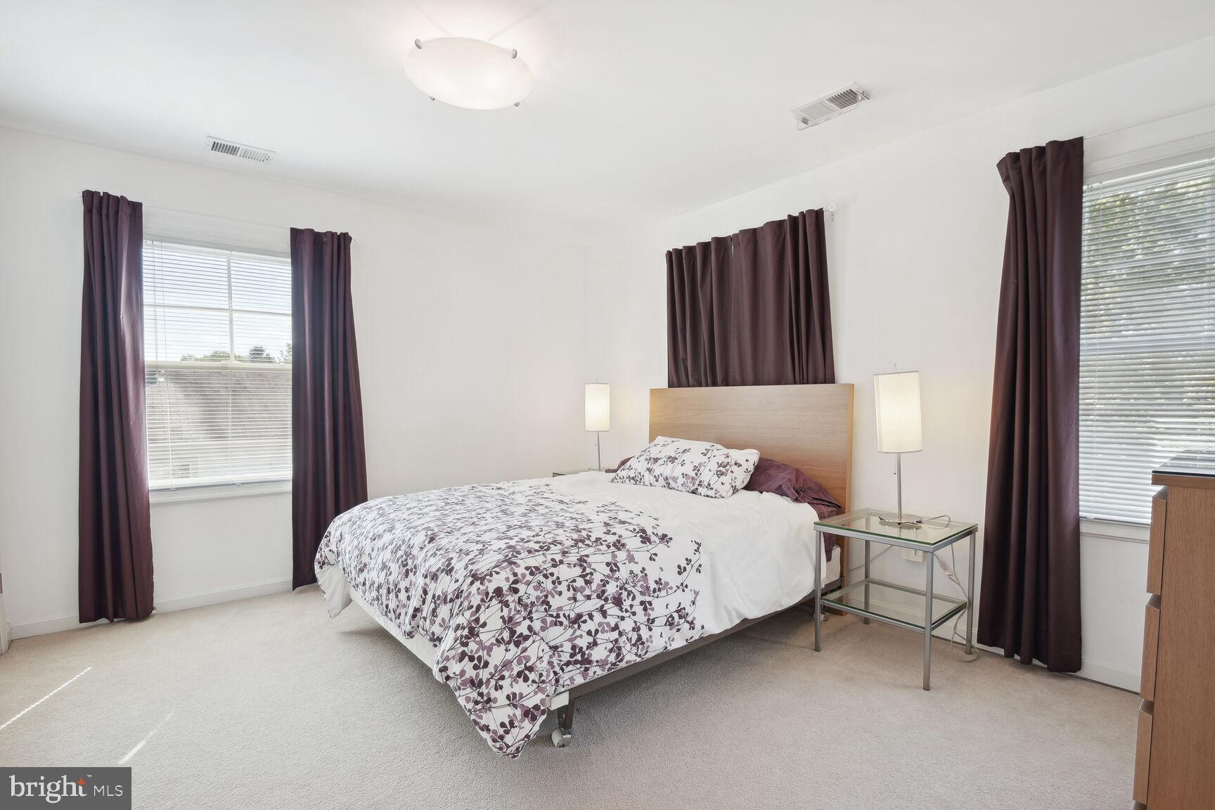 1507 Blue Meadow Road Potomac, MD 20854 - Photo 28 of 36 a bedroom with a bed and a window