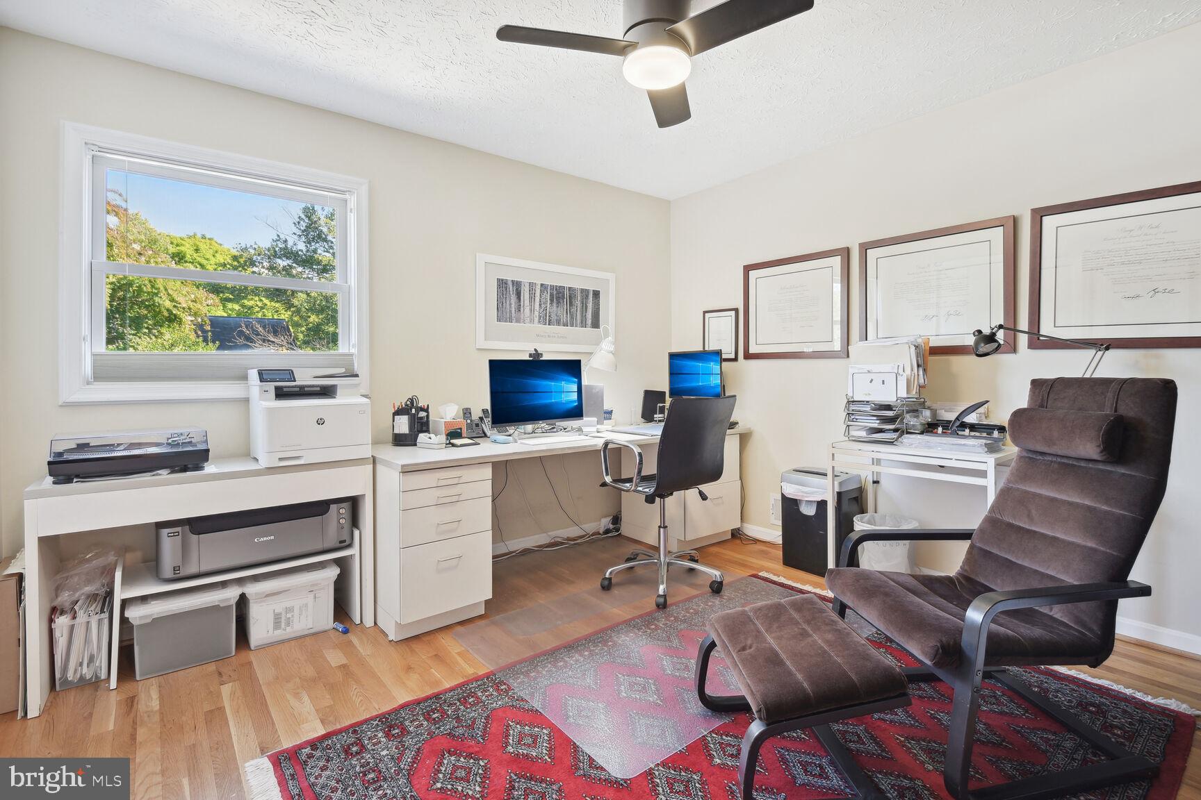 1507 Blue Meadow Road Potomac, MD 20854 - Photo 29 of 36 a kitchen with a table chairs stove and refrigerator