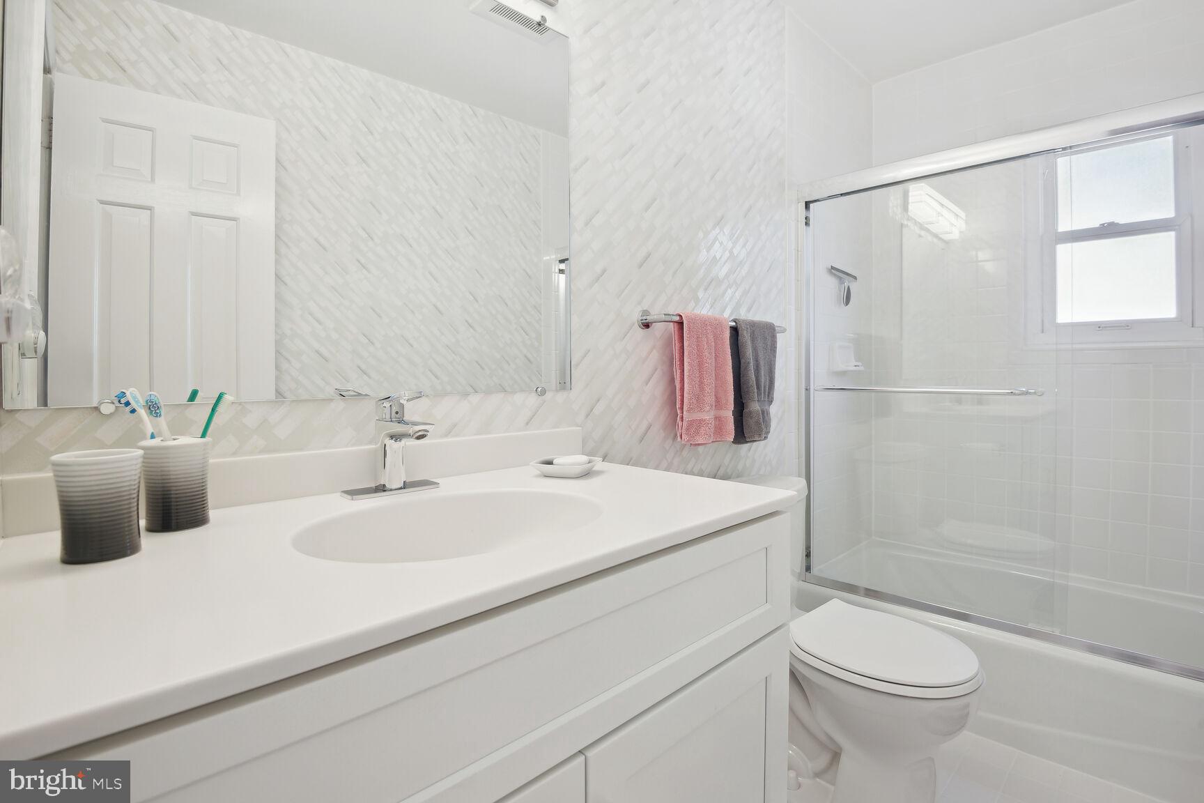 1507 Blue Meadow Road Potomac, MD 20854 - Photo 30 of 36 a bathroom with a sink toilet and shower