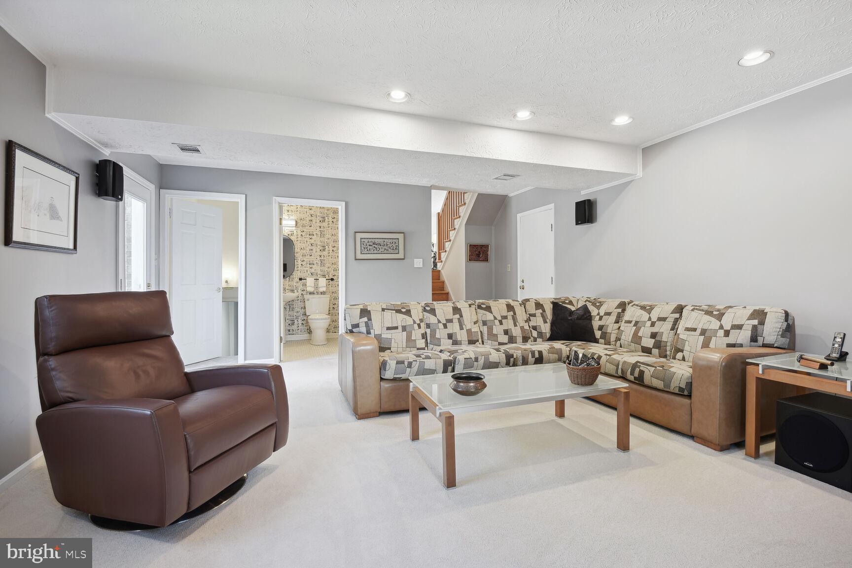 1507 Blue Meadow Road Potomac, MD 20854 - Photo 33 of 36 a living room with furniture and a large window