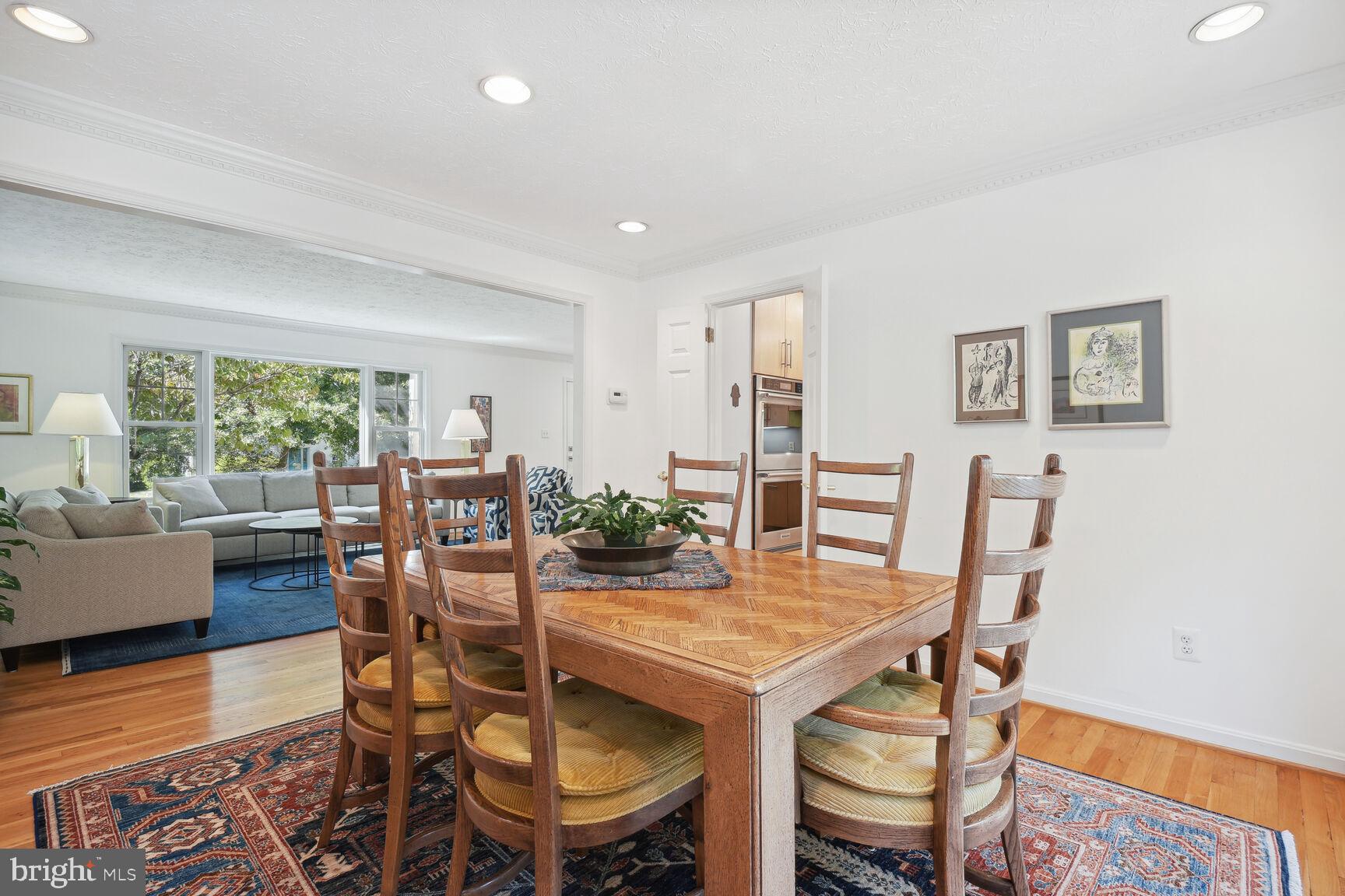 1507 Blue Meadow Road Potomac, MD 20854 - Photo 10 of 36 a view of a dining room with furniture and wooden floor