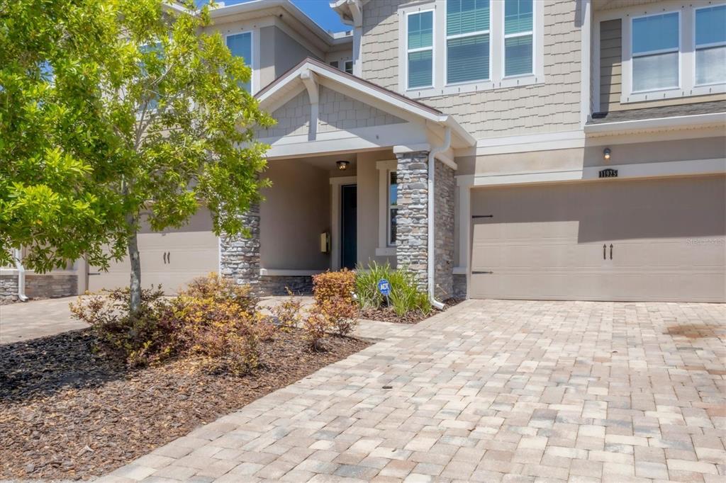 a front view of a house with garden
