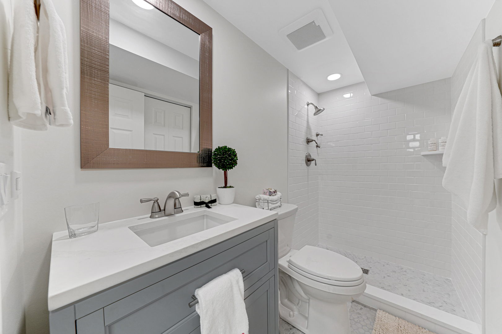 390 South Basswood Road Lake Forest, IL 60045 - Photo 15 of 24 a bathroom with a sink a toilet a mirror and shower