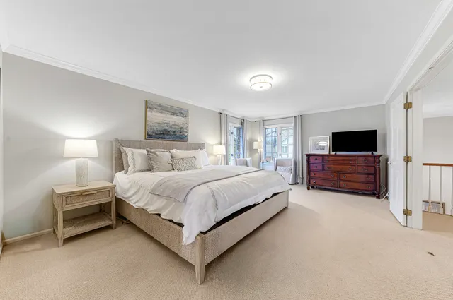 a bedroom with a bed and tv